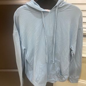 This is a Poof pullover shirt with and open back